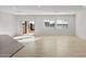 Spacious living area with tile floors and sliding glass doors to backyard at 17869 W Getty Dr, Goodyear, AZ 85338