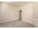 Bedroom with closet and door to another room at 22213 W Patton Rd, Wittmann, AZ 85361