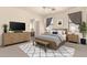 Serene main bedroom featuring neutral walls, a ceiling fan, ample natural light, and cozy furnishings at 22213 W Patton Rd, Wittmann, AZ 85361