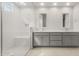 Modern bathroom with double sinks, a spacious shower, and contemporary finishes at 22500 E Orchard Ln, Queen Creek, AZ 85142