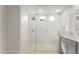 Bright bathroom showcasing a glass-enclosed shower with modern fixtures and tiled walls at 22500 E Orchard Ln, Queen Creek, AZ 85142