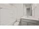 Well-lit bathroom includes a shower-tub combo, a commode, and vanity with a sink at 22500 E Orchard Ln, Queen Creek, AZ 85142