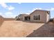 Expansive backyard with potential for landscaping, featuring a covered patio and stucco exterior at 22536 E San Tan Blvd, Queen Creek, AZ 85142