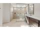 Modern bathroom featuring a glass-enclosed shower with dual showerheads and a sleek vanity with a white countertop at 22536 E San Tan Blvd, Queen Creek, AZ 85142