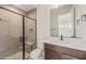 Stylish bathroom featuring a modern shower with a glass enclosure, built-in bench, and a sleek vanity at 22536 E San Tan Blvd, Queen Creek, AZ 85142