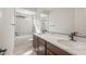 Well-lit bathroom featuring dual sinks with a large mirror, modern fixtures, and a bathtub-shower combination at 22536 E San Tan Blvd, Queen Creek, AZ 85142