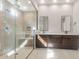 Elegant bathroom featuring dual vanities, a glass shower, and modern finishes for a spa-like experience at 22536 E San Tan Blvd, Queen Creek, AZ 85142