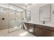 Modern bathroom featuring a glass-enclosed shower, dual vanities, and sleek fixtures at 22536 E San Tan Blvd, Queen Creek, AZ 85142