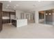 Bright kitchen features a center island, stainless appliances and an open floorplan to the living and dining areas at 22536 E San Tan Blvd, Queen Creek, AZ 85142