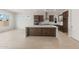 Open-concept kitchen featuring a large center island, stainless steel appliances, and ample cabinet space at 22536 E San Tan Blvd, Queen Creek, AZ 85142