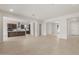 Open-concept living area with tile flooring, showcasing kitchen with stainless steel appliances and center island at 22536 E San Tan Blvd, Queen Creek, AZ 85142