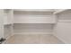 Spacious walk-in closet with ample shelving and hanging space for organized storage and convenience at 22536 E San Tan Blvd, Queen Creek, AZ 85142