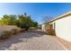 Landscaped backyard with gravel and a glimpse of the pool at 2921 E Lexington Ave, Gilbert, AZ 85234