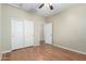 Spacious bedroom with wood floors and closet at 2921 E Lexington Ave, Gilbert, AZ 85234