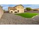 Backyard with artificial turf and a grill at 2985 W Goldmine Mountain Dr, San Tan Valley, AZ 85144