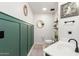 Stylish bathroom with green wainscoting, modern vanity, and updated fixtures at 2985 W Goldmine Mountain Dr, San Tan Valley, AZ 85144