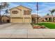 Two-story house with a two-car garage and landscaped lawn at 2985 W Goldmine Mountain Dr, San Tan Valley, AZ 85144