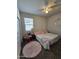 Cozy bedroom with a queen-size bed and soft rug at 44394 W Palo Aliso Way, Maricopa, AZ 85138