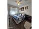 Comfortable bedroom with a king-size bed and stylish bedding at 44394 W Palo Aliso Way, Maricopa, AZ 85138