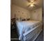 Bright bedroom featuring a king-size bed and updated decor at 44394 W Palo Aliso Way, Maricopa, AZ 85138