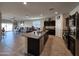 Open concept kitchen with an island and granite countertops at 44394 W Palo Aliso Way, Maricopa, AZ 85138
