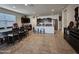 Kitchen with an island, stainless steel appliances, and a dining area at 44394 W Palo Aliso Way, Maricopa, AZ 85138