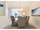 Bright dining room with a chandelier and seating for six at 14133 W Via Montoya --, Sun City West, AZ 85375