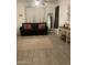 Comfortable living room with neutral rug, updated decor and tiled floors at 15 W Mill Reef Dr, San Tan Valley, AZ 85143