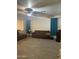 Spacious living room with tile floors, ceiling fan, and comfortable seating area at 15 W Mill Reef Dr, San Tan Valley, AZ 85143