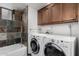 Convenient laundry room with washer, dryer, and cabinets at 15912 E Palomino Blvd, Fountain Hills, AZ 85268