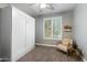 Bright bedroom with a built-in wall bed and window shutters at 1769 W Goldfinch Way, Chandler, AZ 85286