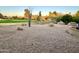 Landscaped backyard with golf course view at 18626 E Poco Rio Dr, Rio Verde, AZ 85263