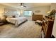 Large bedroom with king-size bed, ample closet space, and natural light at 18626 E Poco Rio Dr, Rio Verde, AZ 85263