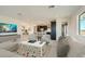 Bright and inviting living room showcases an open floor plan, seamlessly connecting to the kitchen and dining area at 2121 W Sonoran Desert Dr # 29, Phoenix, AZ 85085