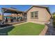 Landscaped backyard featuring a gazebo and patio at 303 W Mammoth Cave Dr, San Tan Valley, AZ 85140