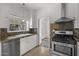 Updated kitchen with stainless steel appliances and stone backsplash at 315 W Roma Ave, Phoenix, AZ 85013