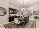 Elegant dining room with a large table, chandelier, and built-in cabinetry at 40811 N River Bend Rd, Phoenix, AZ 85086