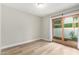 Bedroom with sliding glass door and wood-look flooring at 4920 E Edgemont Ave, Phoenix, AZ 85008