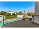 View of a backyard with a pool and lounge chairs from the raised deck at 6174 E Janice Way, Scottsdale, AZ 85254