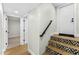 Interior stairway with decorative detail and a black metal handrail at 6174 E Janice Way, Scottsdale, AZ 85254