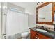 Bathroom with shower/tub combo, vanity, and star mirror at 6713 E Paradise Ln, Scottsdale, AZ 85254