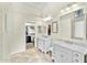 Bathroom boasts double vanity, marble counters, and a separate shower at 6713 E Paradise Ln, Scottsdale, AZ 85254
