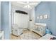 Charming bedroom with ceiling fan, crib, and dresser at 6713 E Paradise Ln, Scottsdale, AZ 85254