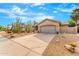 Front yard with drought-tolerant landscaping at 6713 E Paradise Ln, Scottsdale, AZ 85254