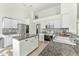 Open kitchen with island, granite counters, and breakfast nook at 6713 E Paradise Ln, Scottsdale, AZ 85254