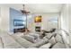 Open living room with sectional sofa and a fireplace at 6713 E Paradise Ln, Scottsdale, AZ 85254