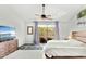 Main bedroom features a king bed and access to backyard at 6713 E Paradise Ln, Scottsdale, AZ 85254