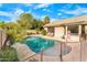 Inviting kidney shaped pool with safety fence at 6713 E Paradise Ln, Scottsdale, AZ 85254