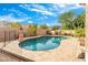 Relaxing kidney shaped pool and patio area at 6713 E Paradise Ln, Scottsdale, AZ 85254