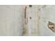 Large shower with modern tile and built-in bench seat at 6713 E Paradise Ln, Scottsdale, AZ 85254